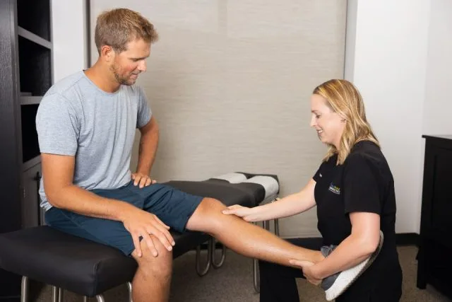 Dr Acton working on a sports injury