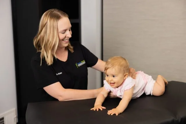 Dr acton with a toddler patient